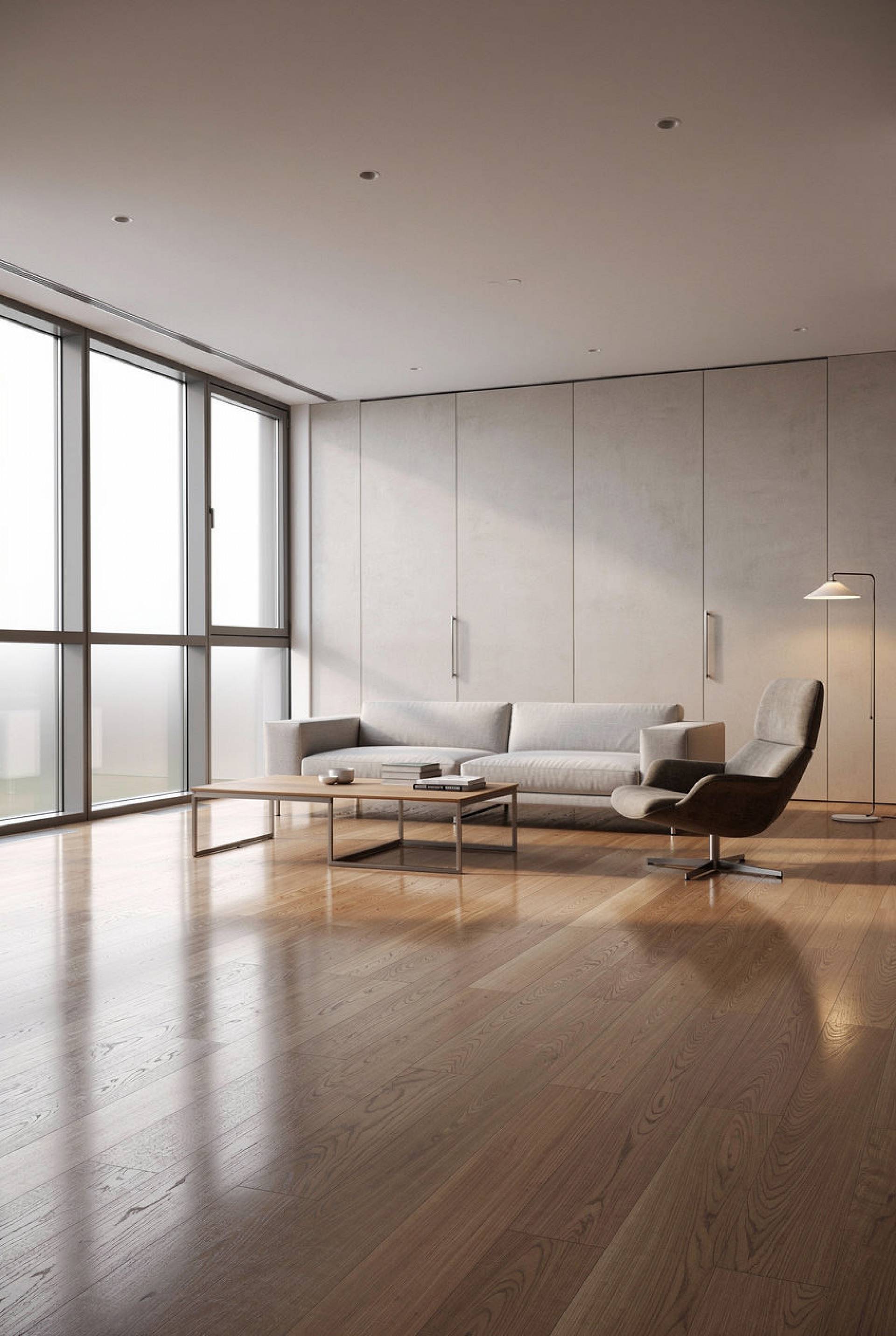 Moderner Wohnraum mit großformatigem Parkettboden aus Holz, bodentiefen Fenstern und klarer Architektur.